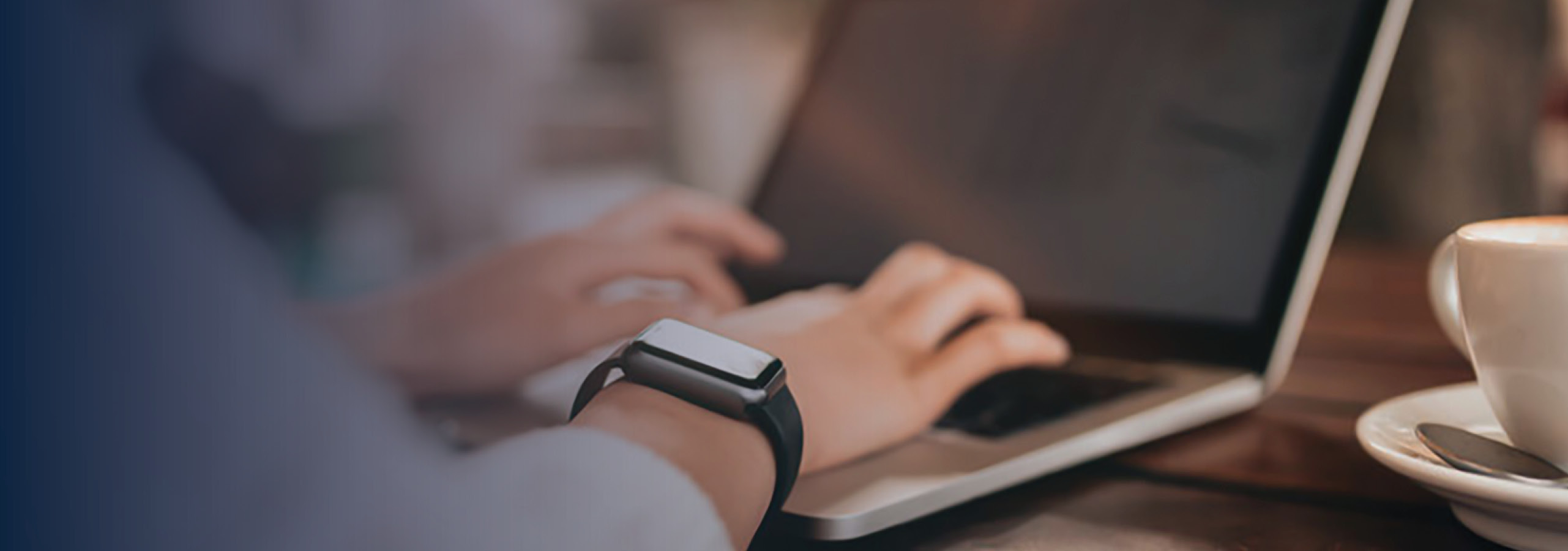 Woman's hand on laptop keyboard