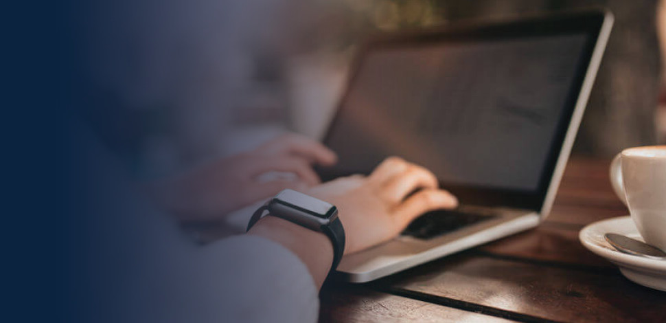 Woman's hand on laptop keyboard