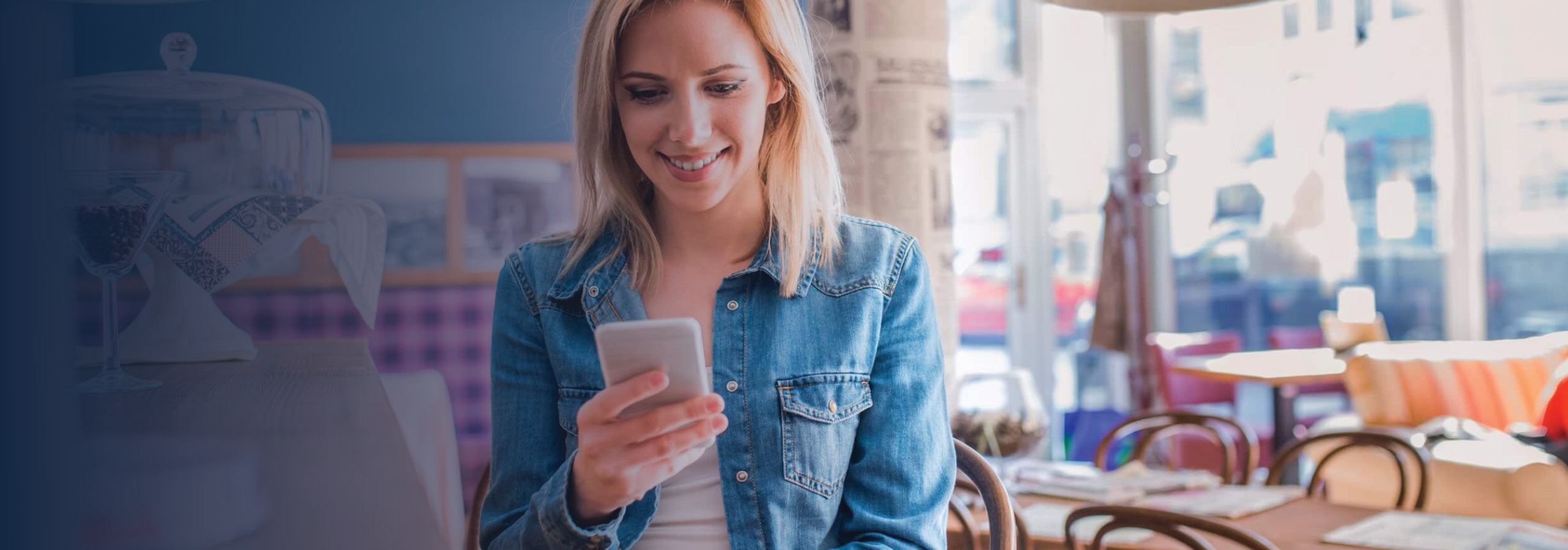 Woman checking phone in restaurant