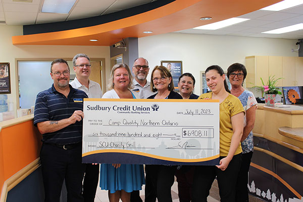 SCU staff presenting a donation to the Sudbury Rainbow Crime Stoppers
