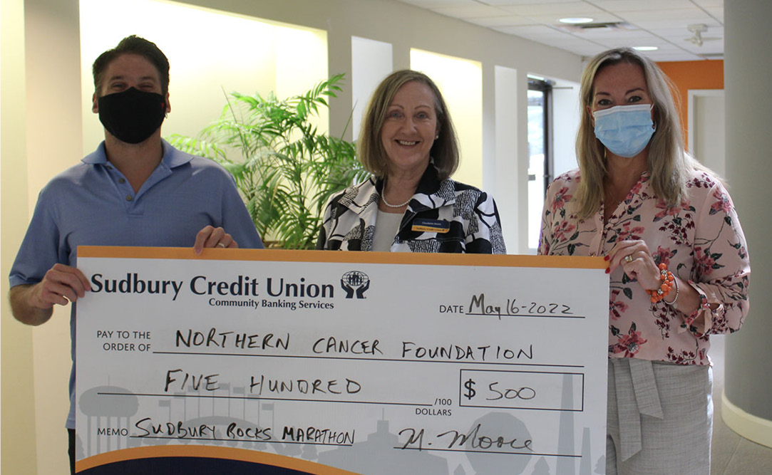SCU staff presenting a donation to the Northern Cancer Foundation