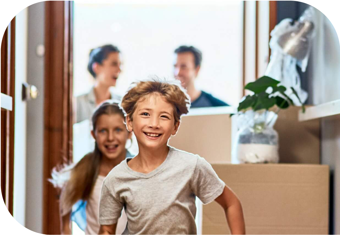 Children running into new home ahead of parents