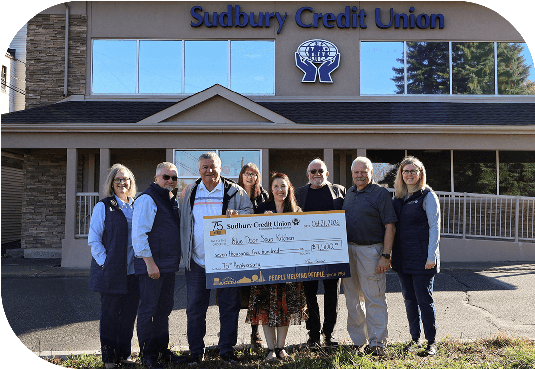 SCU staff present a cheque for $7,500 to the Blue Door Soup Kitchen