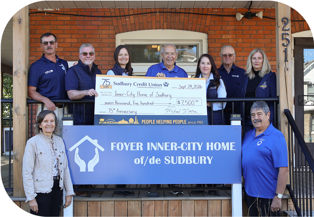 SCU staff present a cheque for $7,500 to the Inner-City Home of Sudbury
