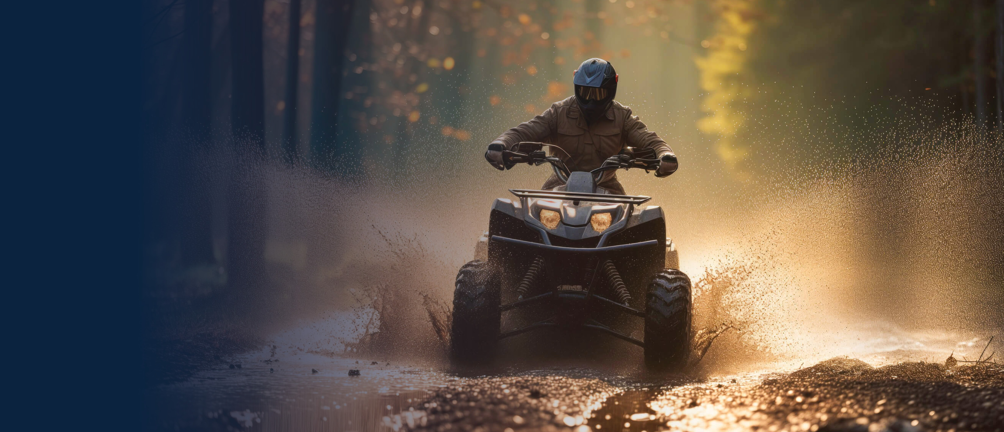 ATV being driven through a mud puddle in a forest.