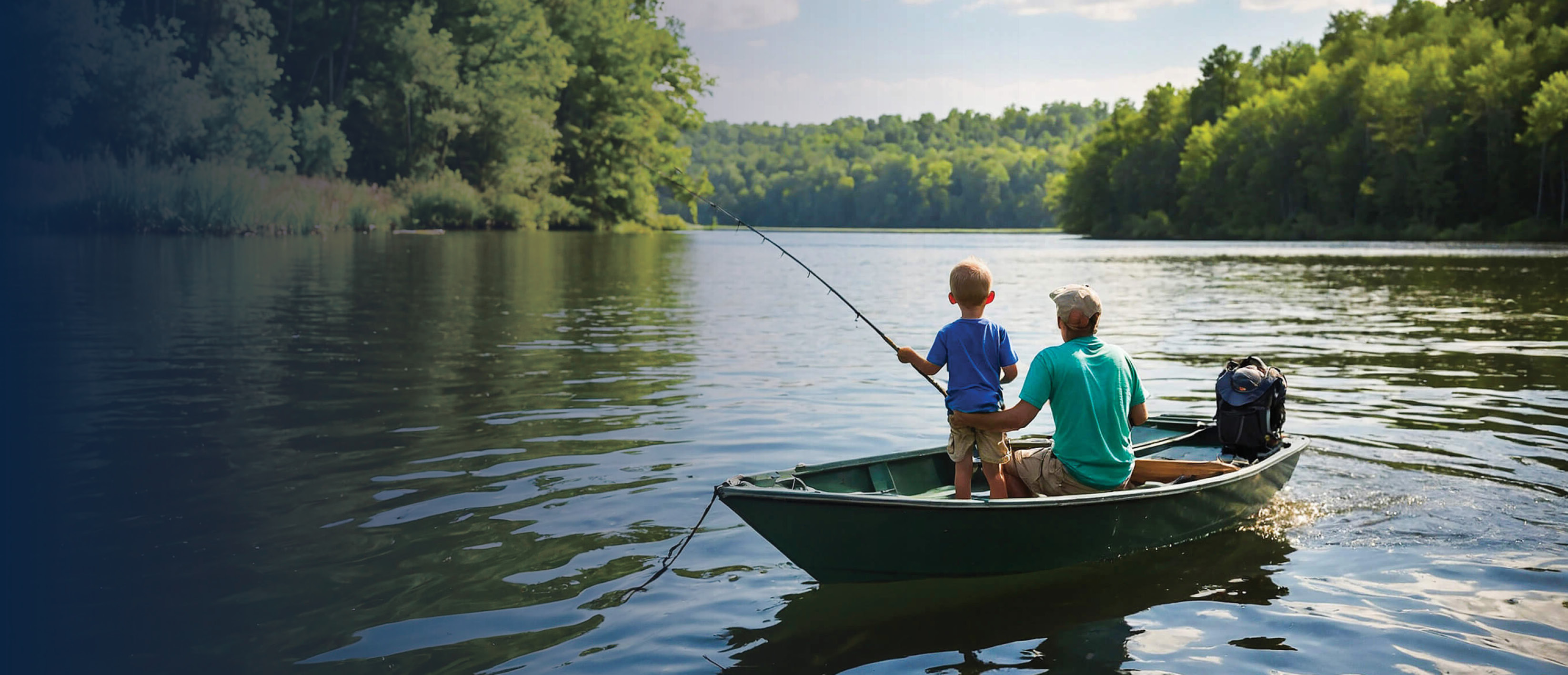 Father and young sun in a fishing boat on a lake.
