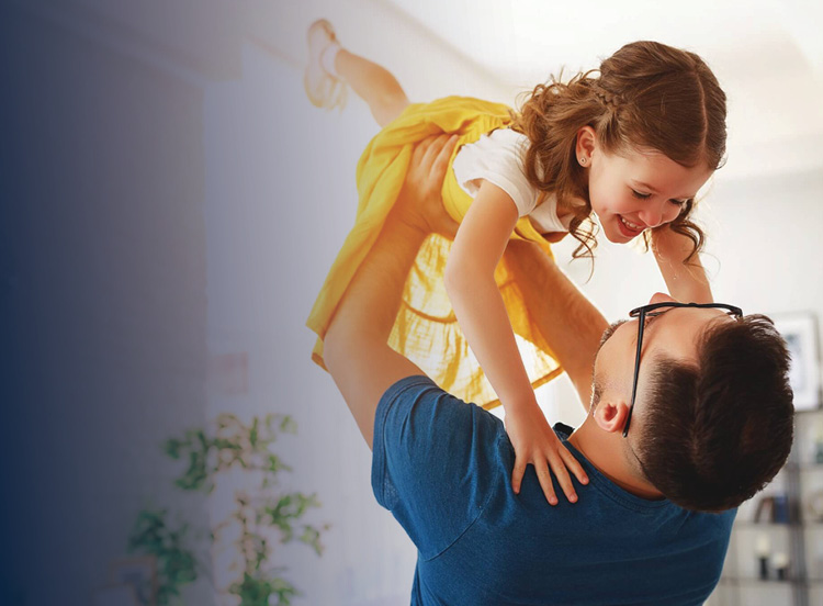Father holding his young daughter up over his head