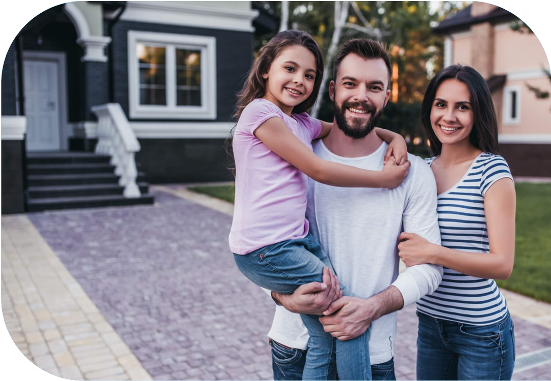 Family standing in front of their home