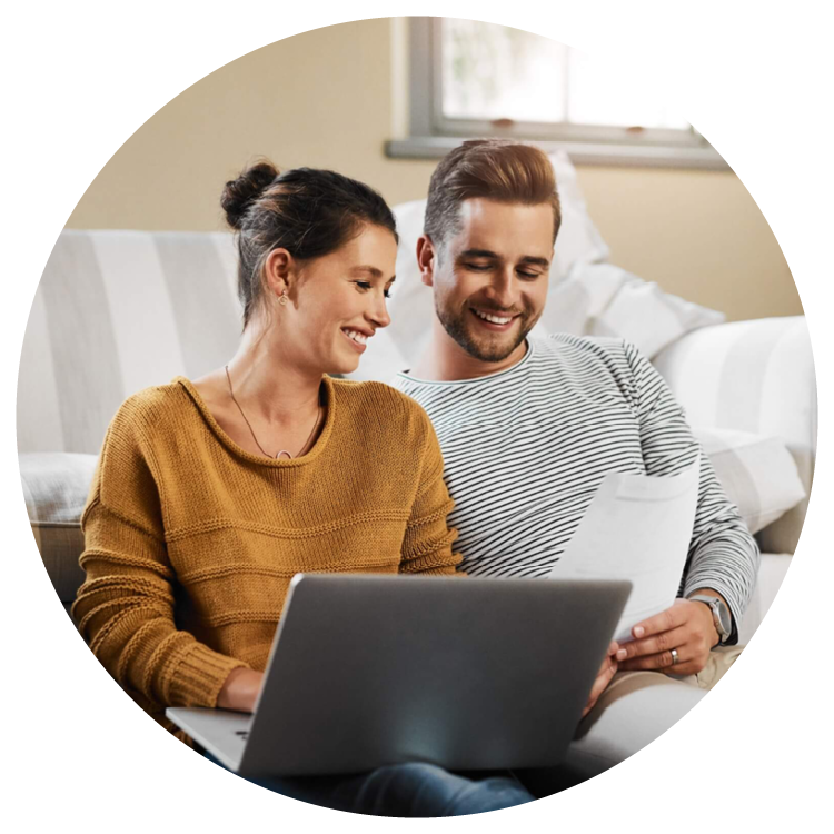 Couple reviewing information together on a laptop