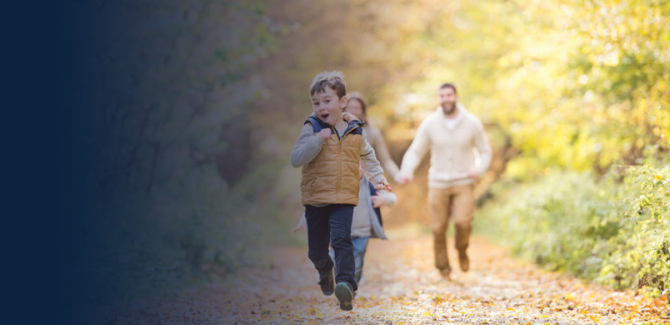 Young family on a walk in forest