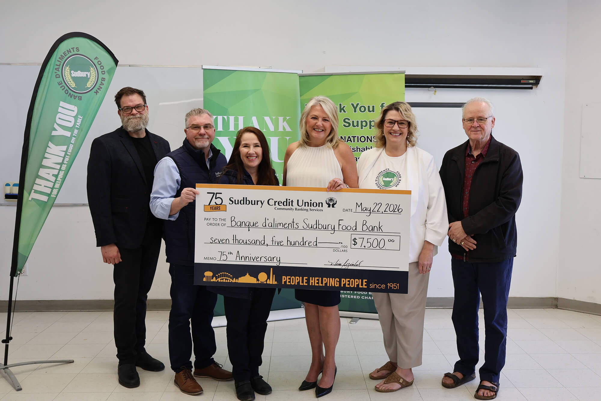 SCU staff present a cheque for $7,500 to Sudbury Food Bank