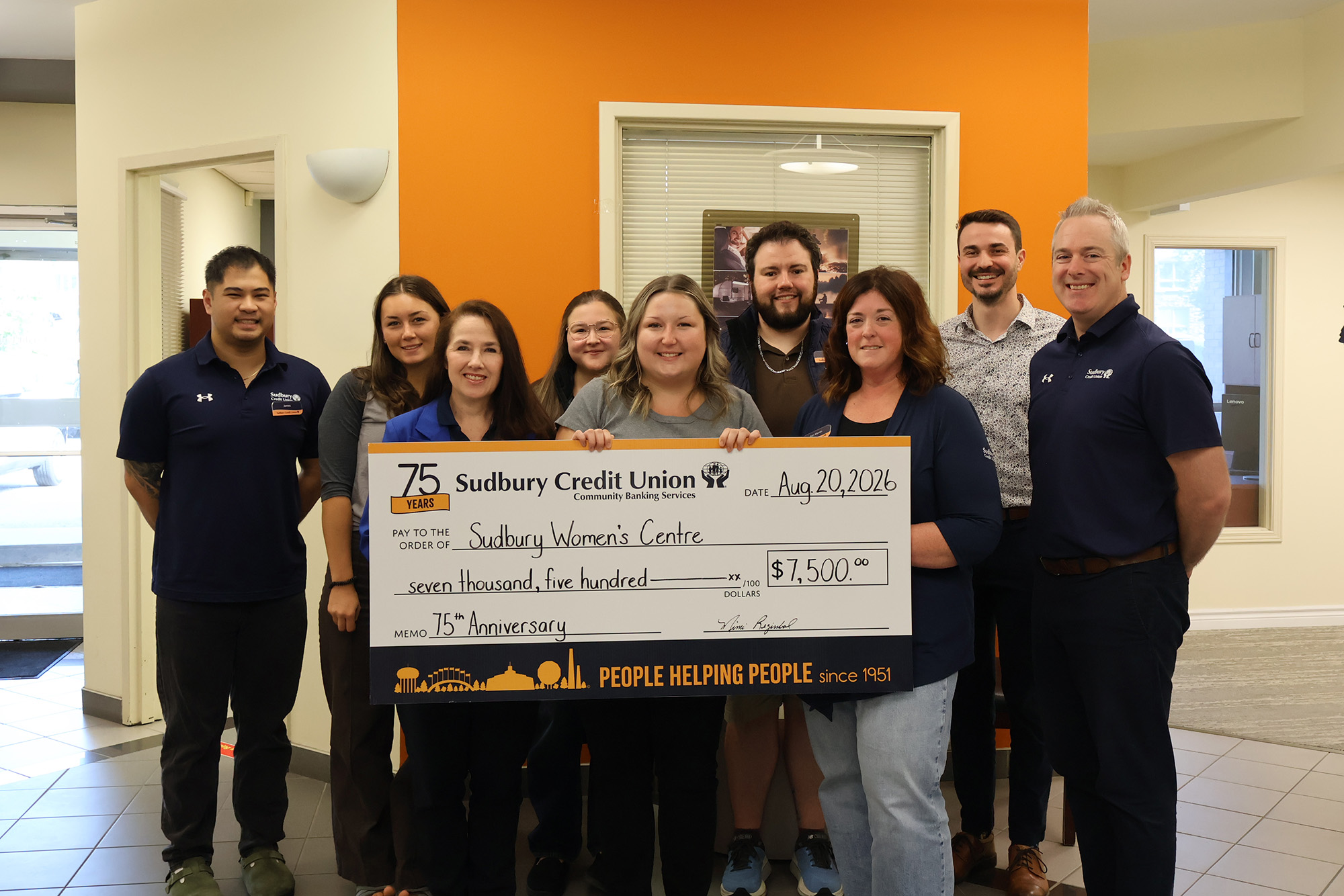 SCU staff present a cheque for $7,500 to the Sudbury Women's Centre.