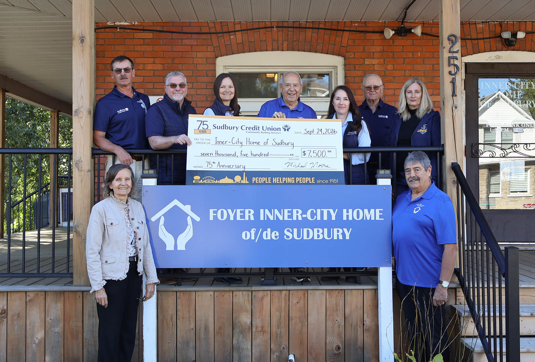 SCU staff present a cheque for $7,500 to Inner-City Home of Sudbury