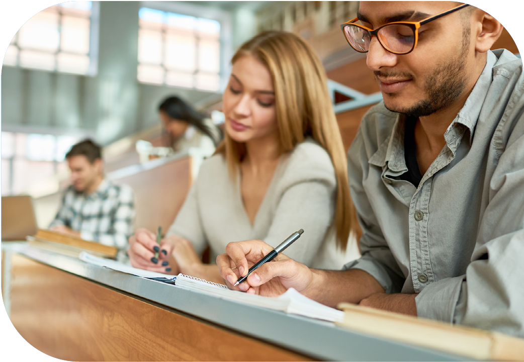 University students taking notes in class