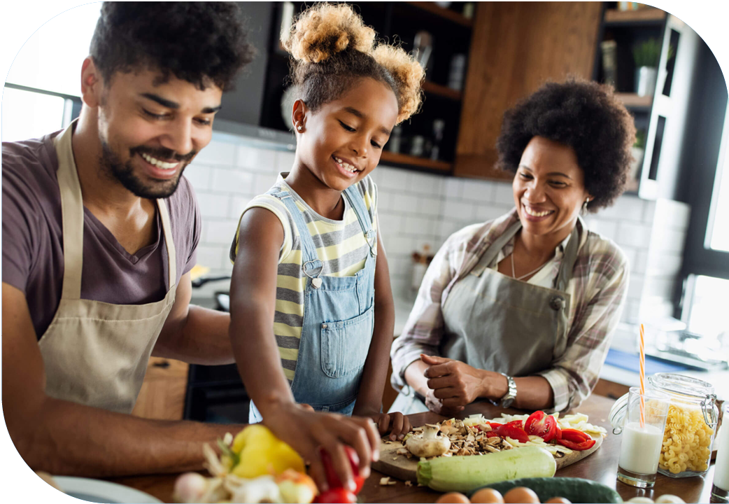 Family preparing a meal together in kitchen.