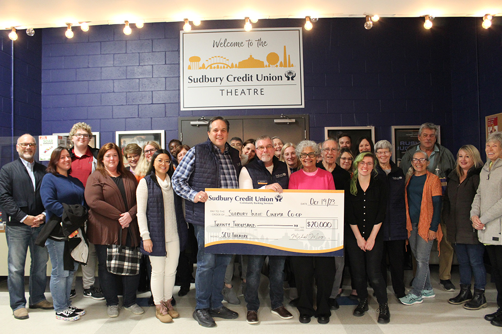 Staff, board and members present a donation to Sudbury Indie Cinema