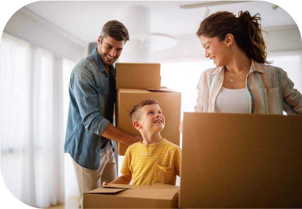 Couple and young son packing boxes