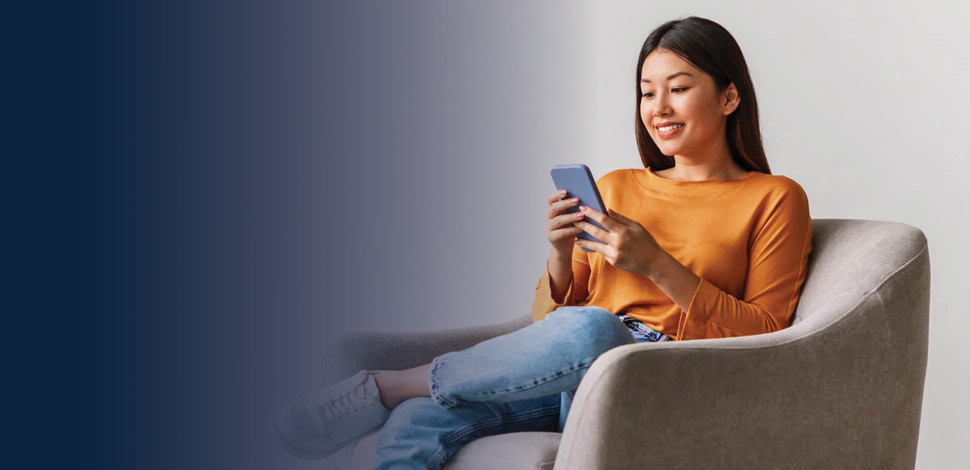 Woman on phone while working at a computer