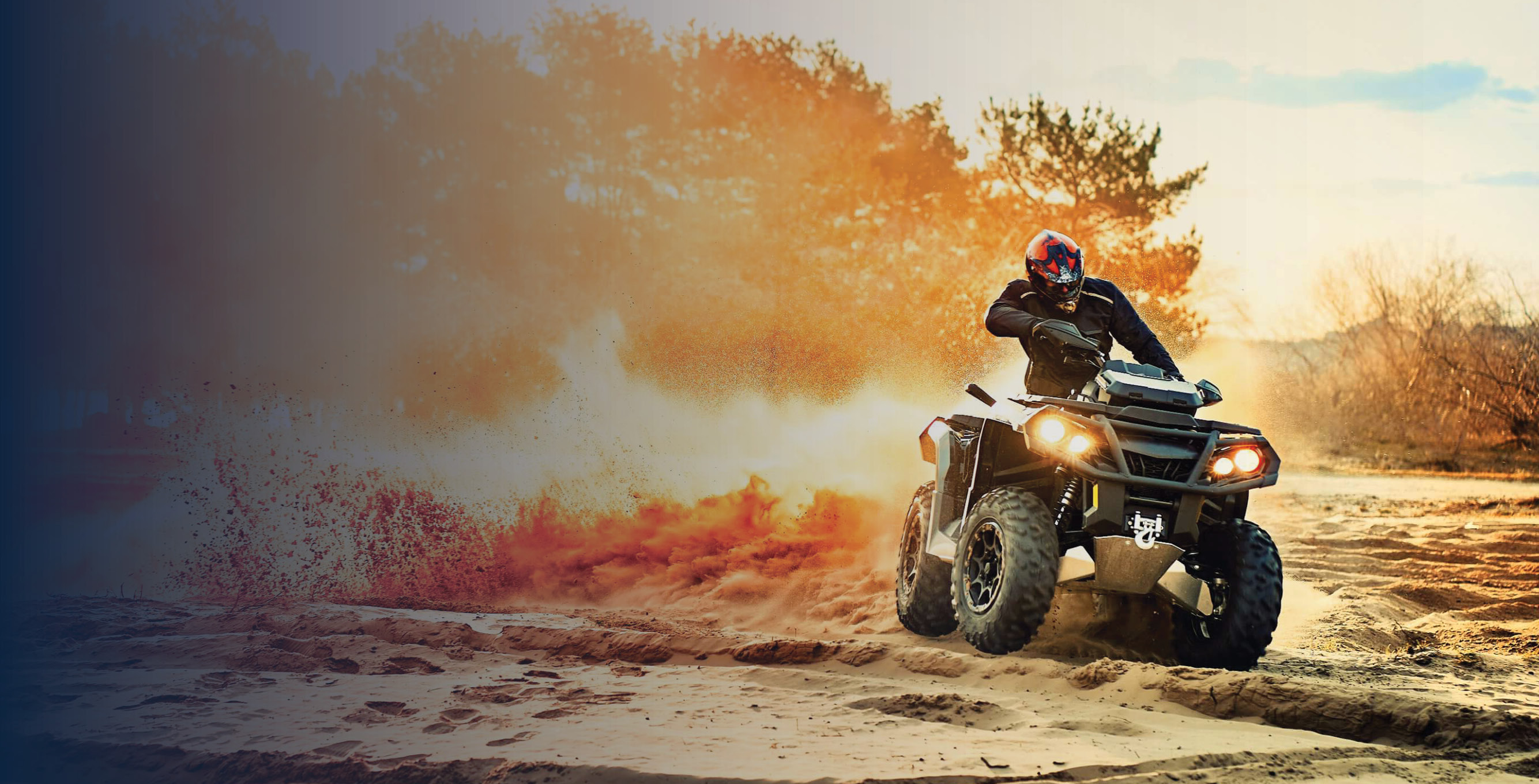 Quad driving through mud