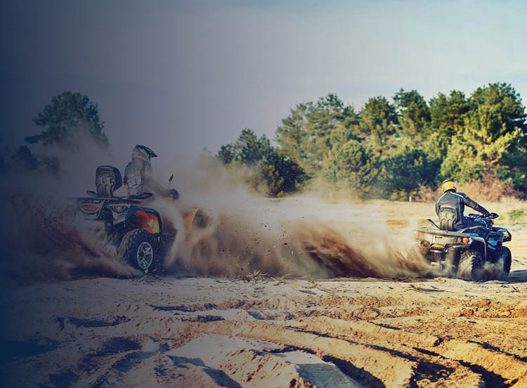 ATVs driving through mud
