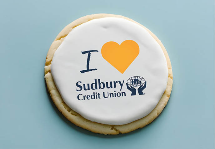 SCU staff holding sugar cookies